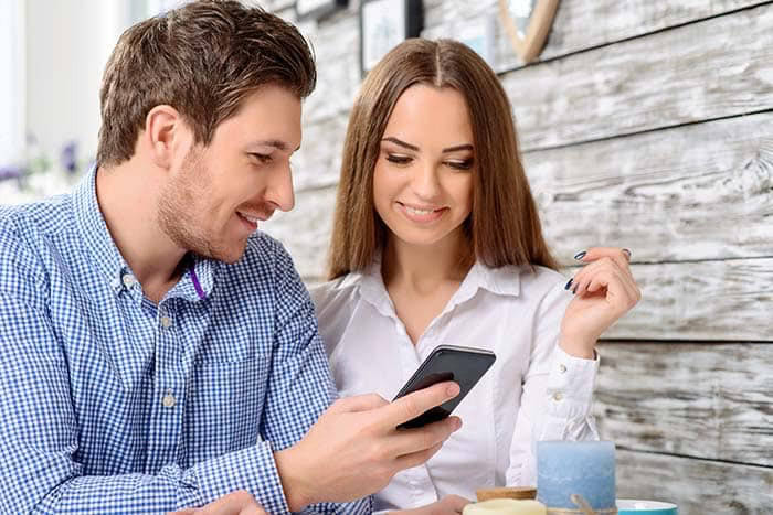 Couple looking phone